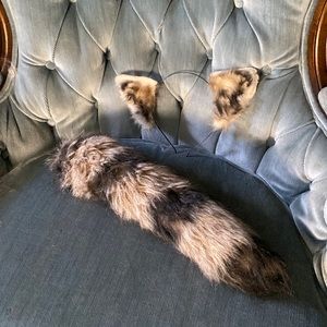 Faux raccoon ears and tail set. By Woodland Creatures.